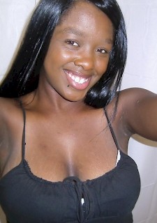 Busty ebony girlfriend takes selfshot pictures of her big tits