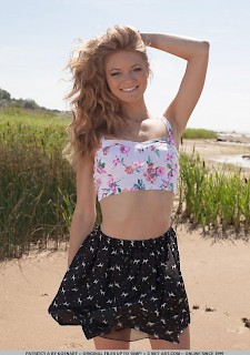 Blonde teen Patritcy A gets naked for you on the beach