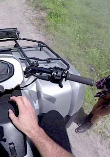 Hiker Rides A Quad