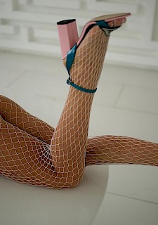 pretty model Jessy Q stripping and posing in her fishnets